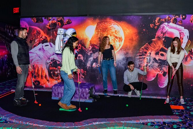 American Dream Black Light Indoor Mini Golf Ticket - Playing among planets at American Dream