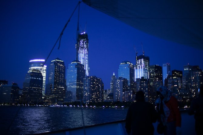 New York City Sunset Jazz Sail aboard Clipper City - Passing the park landmark and Ellis Island