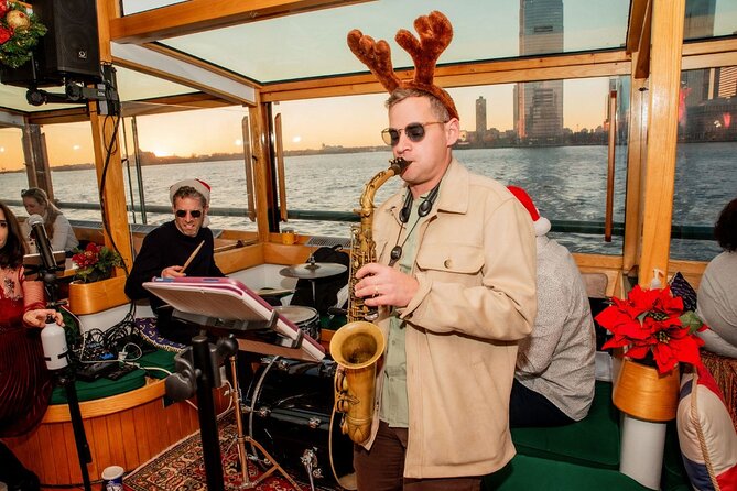 New York Harbor Live Holiday Jazz Cruise - The Statue of Liberty after dark