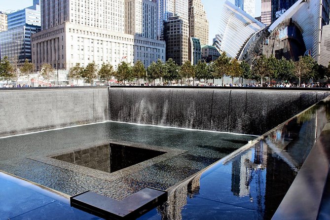 NYC City Tour: Statue of Liberty, 9/11 Memorial, Wall Street - Walking Wall Street beyond the Charging Bull