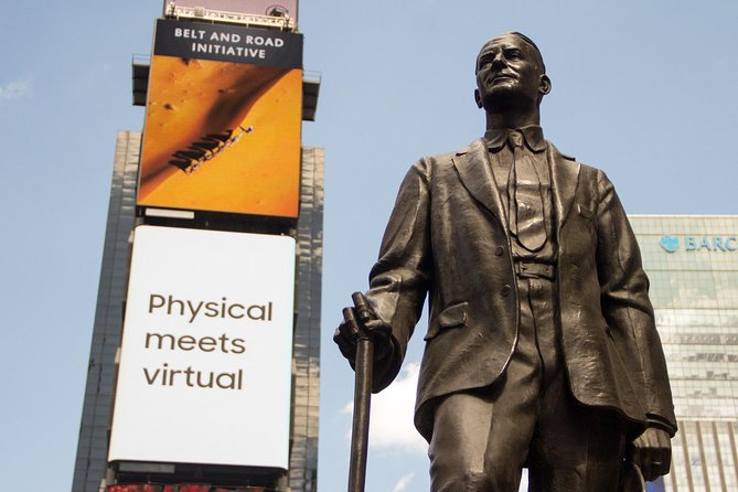 NYC in a Day Tour: Statue of Liberty, Times Square and More - A fast start beneath the George M. Cohan statue