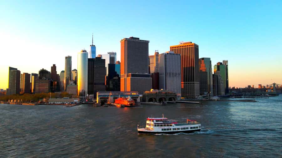 NYC: Statue of Liberty Sunset Cruise Skip-the-Line Ticket - Leaving Pier 16 for the harbor