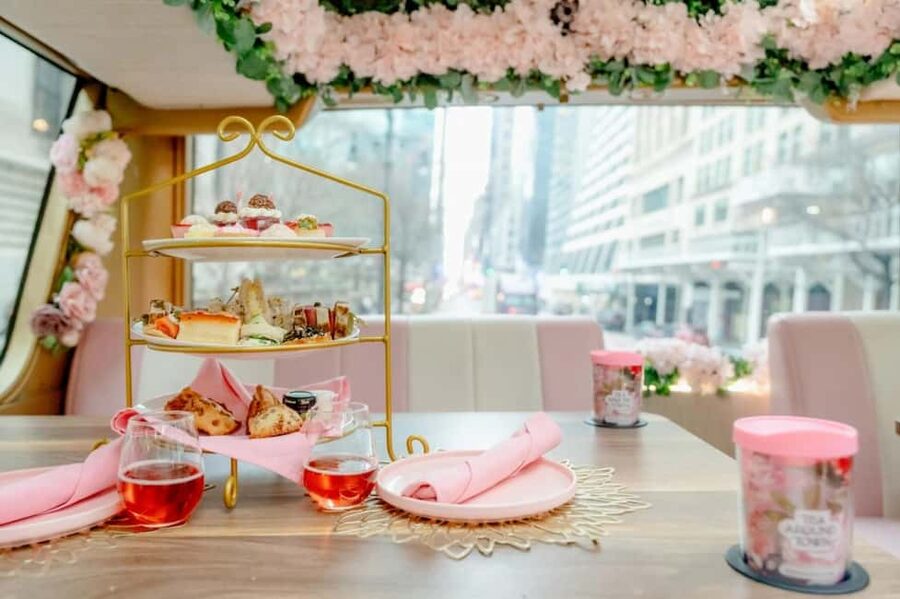 NYC: Tea Around Town Bus Tour with Live Entertainment - Tea service with Manhattan outside the window