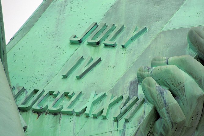 Statue of Liberty, Ellis Island, and 9/11 Memorial Guided Tour - Wall Street and the walk to Ground Zero